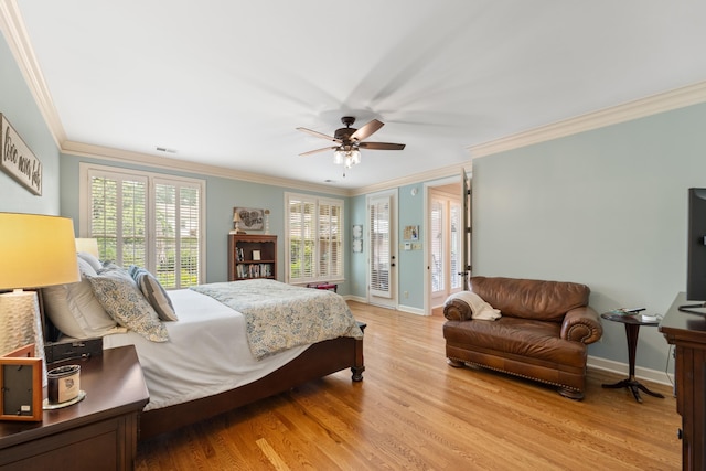 9245 Forest Estates Cv, Germantown, TN 38139 - bedroom with crown molding, baseboards, light wood finished floors, a ceiling fan, and access to exterior