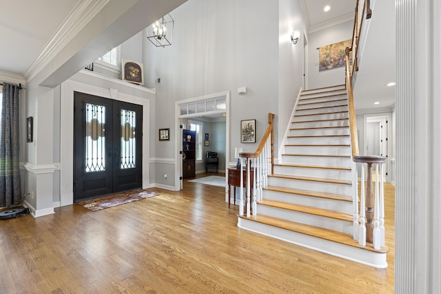 9245 Forest Estates Cv, Germantown, TN 38139 - foyer with stairway, french doors, crown molding, wood finished floors, and plenty of natural light