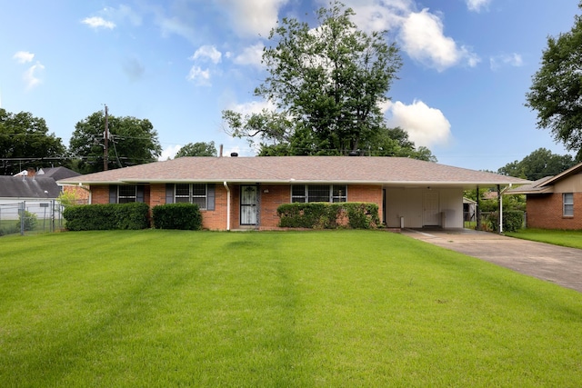 5151 Canton Dr, Memphis, TN 38116 - ranch-style home with driveway, brick siding, an attached carport, and a shingled roof