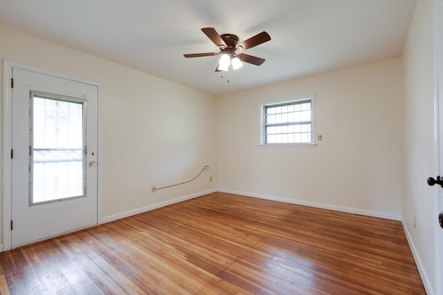 5151 Canton Dr, Memphis, TN 38116 - empty room featuring light wood finished floors, ceiling fan, and baseboards