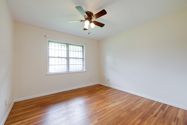 5151 Canton Dr, Memphis, TN 38116 - empty room with light wood-type flooring, baseboards, and a ceiling fan
