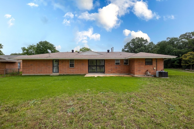 5151 Canton Dr, Memphis, TN 38116 - back of property featuring central AC, a patio area, and brick siding