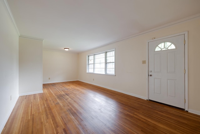 5151 Canton Dr, Memphis, TN 38116 - entryway with light wood finished floors, baseboards, and crown molding