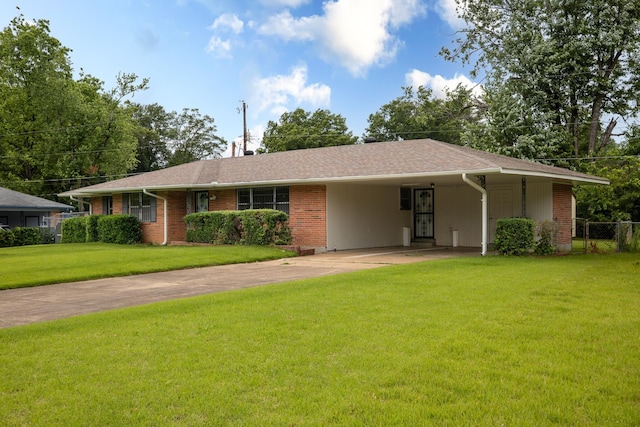 5151 Canton Dr, Memphis, TN 38116 - ranch-style home with concrete driveway, a carport, and brick siding