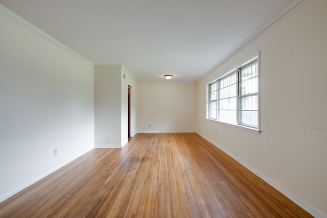 5151 Canton Dr, Memphis, TN 38116 - empty room featuring wood-type flooring, baseboards, and ornamental molding