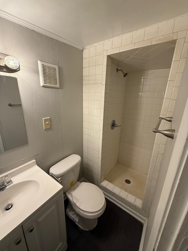 3223 Boone St, Memphis, TN 38127 - bathroom with toilet, a tile shower, and vanity