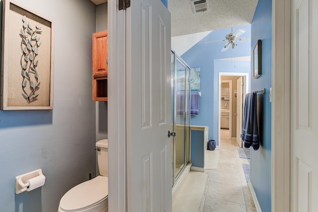 3120 Caledonia Rd, Memphis, TN 38119 - bathroom featuring a shower stall, toilet, a ceiling fan, tile patterned flooring, and baseboards