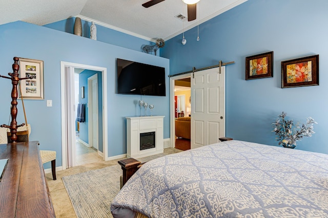 3120 Caledonia Rd, Memphis, TN 38119 - bedroom featuring light colored carpet, a barn door, a glass covered fireplace, crown molding, and a ceiling fan