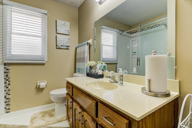 3120 Caledonia Rd, Memphis, TN 38119 - full bath featuring a stall shower, a textured ceiling, toilet, vanity, and tile patterned floors