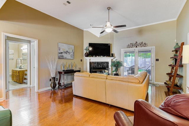 3120 Caledonia Rd, Memphis, TN 38119 - living room featuring a ceiling fan, a high end fireplace, light wood-style flooring, crown molding, and baseboards