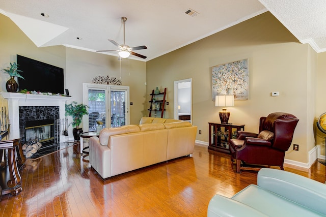3120 Caledonia Rd, Memphis, TN 38119 - living room featuring hardwood / wood-style flooring, a ceiling fan, ornamental molding, a premium fireplace, and baseboards