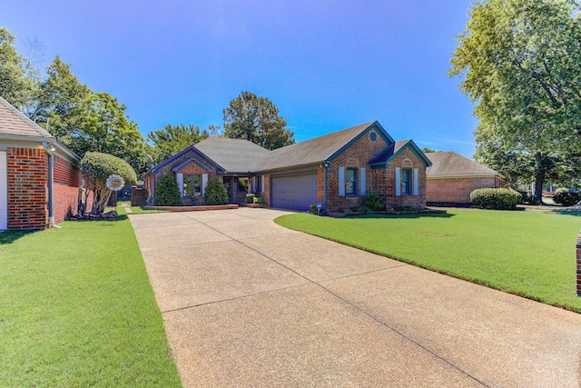 3120 Caledonia Rd, Memphis, TN 38119 - ranch-style home featuring a garage, brick siding, concrete driveway, and a front lawn