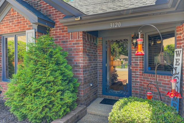 3120 Caledonia Rd, Memphis, TN 38119 - doorway to property featuring brick siding and roof with shingles