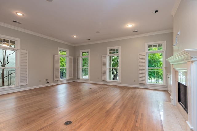 1060 Island Dr, Memphis, TN 38103 - unfurnished living room with light wood-style flooring, a fireplace, crown molding, baseboards, and recessed lighting