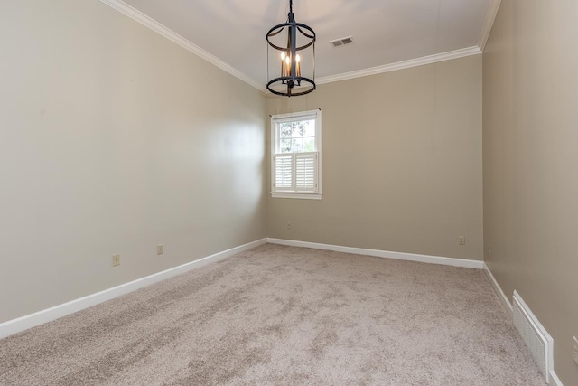 1060 Island Dr, Memphis, TN 38103 - spare room with a chandelier, ornamental molding, carpet flooring, and baseboards