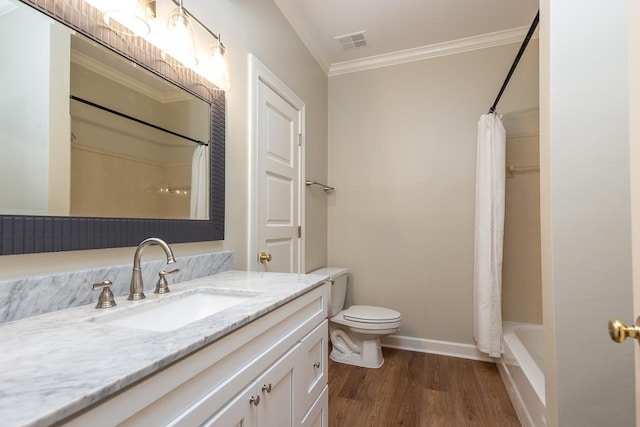 1060 Island Dr, Memphis, TN 38103 - bathroom with vanity, crown molding, wood finished floors, toilet, and baseboards