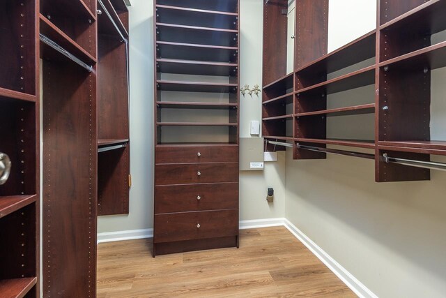 1060 Island Dr, Memphis, TN 38103 - spacious closet featuring wood finished floors