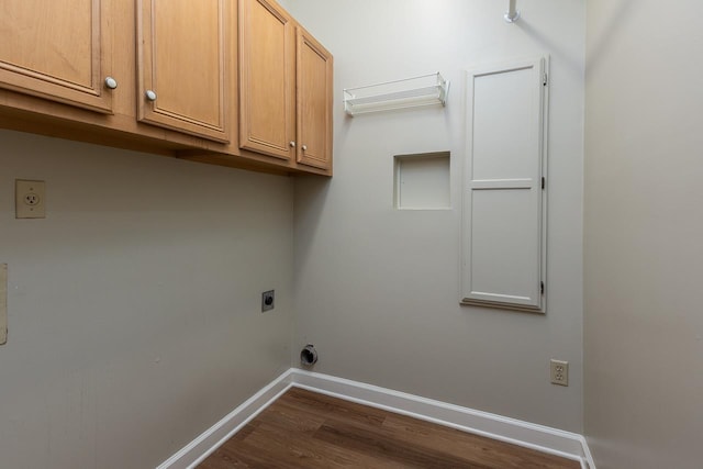 1060 Island Dr, Memphis, TN 38103 - washroom with hookup for an electric dryer, cabinet space, dark wood-style flooring, and baseboards
