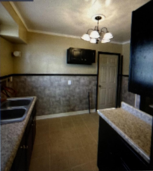 361 Jacklyn Ave, Memphis, TN 38106 - kitchen with a chandelier and carpet