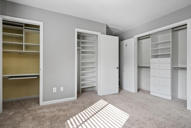1829 Eagle Branch Cv Unit 41, Germantown, TN 38138 - unfurnished bedroom featuring carpet floors, two closets, and baseboards