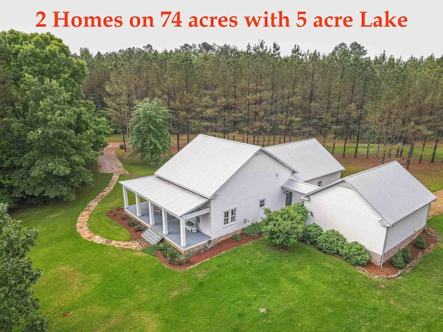 504 Rushing Rd, Michie, TN 38357 - view from above of property featuring a heavily wooded area