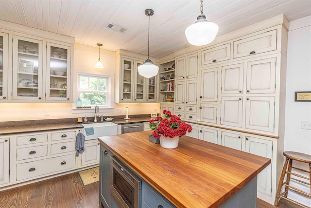 504 Rushing Rd, Michie, TN 38357 - kitchen with wood counters, a sink, stainless steel appliances, dark wood-style flooring, and pendant lighting