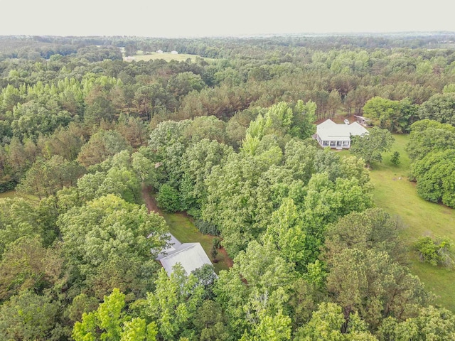 504 Rushing Rd, Michie, TN 38357 - aerial view of property and surrounding area featuring a heavily wooded area