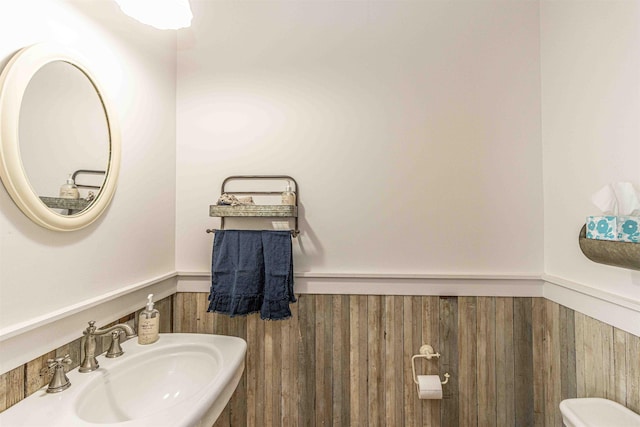 504 Rushing Rd, Michie, TN 38357 - bathroom featuring a sink, a wainscoted wall, and toilet