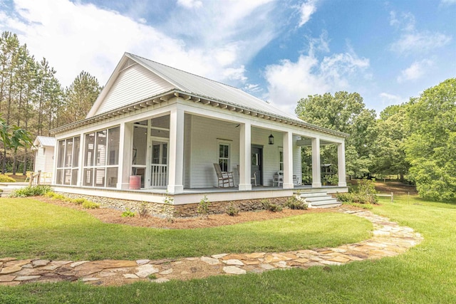 504 Rushing Rd, Michie, TN 38357 - view of property exterior featuring a yard, metal roof, and a porch