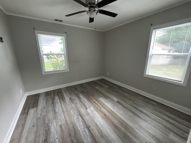 411 Hodges St, Memphis, TN 38111 - spare room featuring dark wood-style flooring, crown molding, baseboards, and ceiling fan