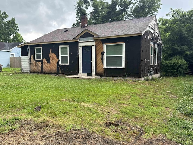 411 Hodges St, Memphis, TN 38111 - bungalow-style home with a front yard, a chimney, and roof with shingles