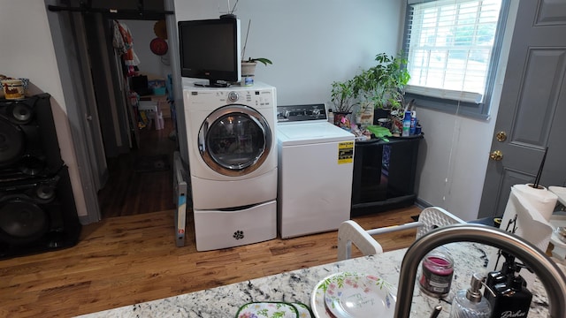 2304 Longstreet Dr, Memphis, TN 38114 - laundry room featuring washing machine and dryer and wood finished floors