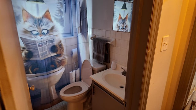 2304 Longstreet Dr, Memphis, TN 38114 - bathroom with tile walls, toilet, and vanity