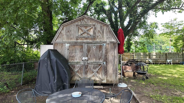 2304 Longstreet Dr, Memphis, TN 38114 - view of shed with a fenced backyard and outdoor dining area