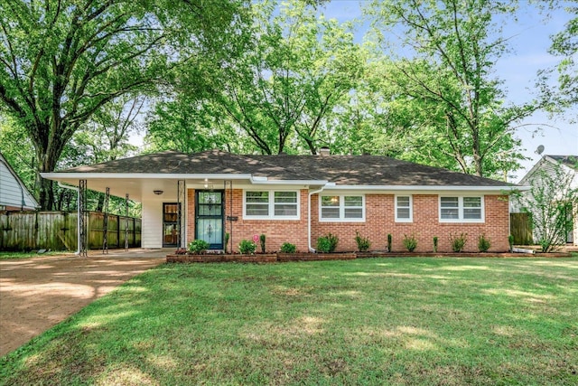 5313 Dorsey Ave, Memphis, TN 38120 - ranch-style house with concrete driveway, a carport, and brick siding