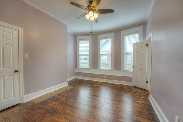 1224 Faxon Ave, Memphis, TN 38104 - spare room with ornamental molding, dark wood finished floors, plenty of natural light, ceiling fan, and baseboards