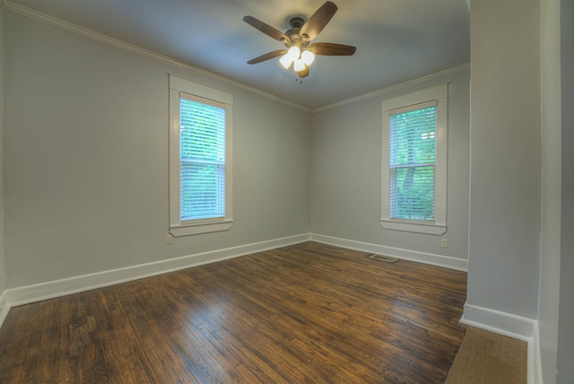 1224 Faxon Ave, Memphis, TN 38104 - empty room featuring baseboards, dark wood-style floors, ceiling fan, and crown molding