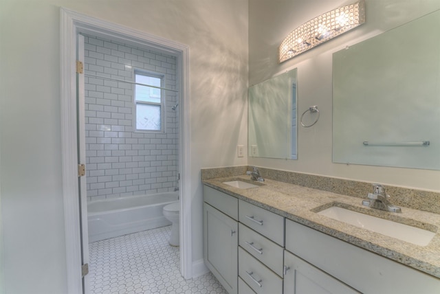 1224 Faxon Ave, Memphis, TN 38104 - bathroom with toilet, double vanity, tile patterned flooring, and shower / washtub combination