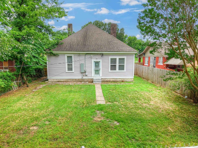 1224 Faxon Ave, Memphis, TN 38104 - back of property featuring a chimney and roof with shingles
