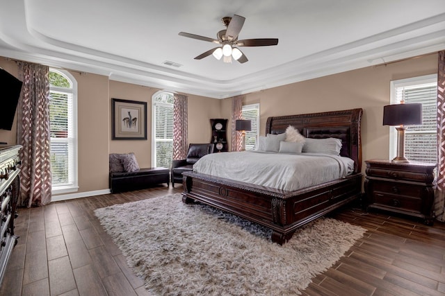 546 Township Cv, Collierville, TN 38017 - bedroom with a raised ceiling, wood finished floors, a ceiling fan, and baseboards