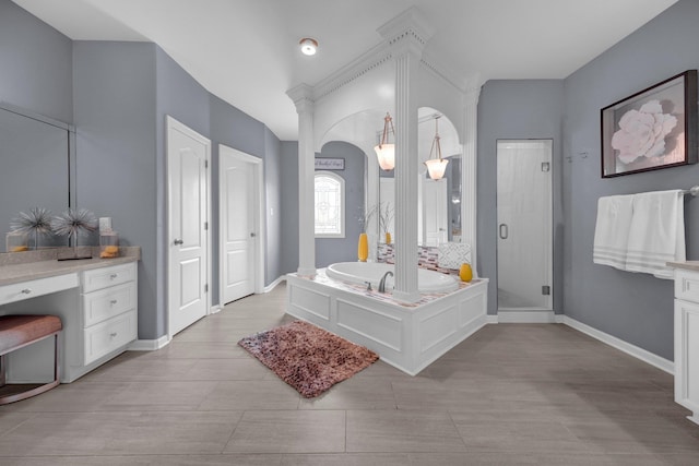 546 Township Cv, Collierville, TN 38017 - full bath featuring a bath, a stall shower, baseboards, vanity, and wood finished floors