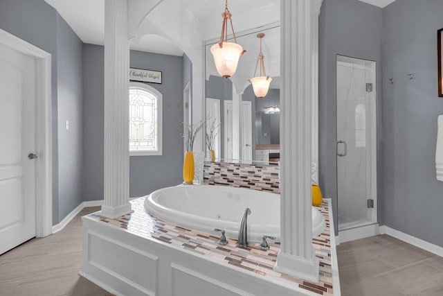 546 Township Cv, Collierville, TN 38017 - bathroom featuring a tub with jets, a shower stall, and baseboards