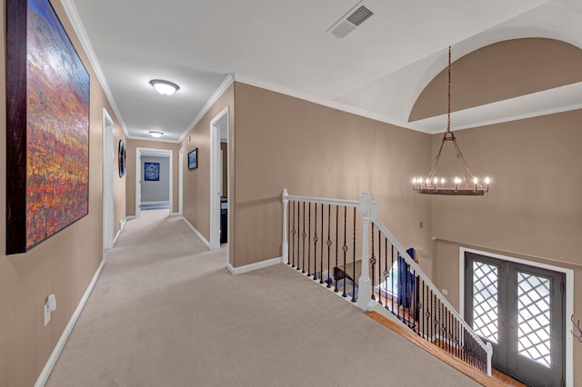 546 Township Cv, Collierville, TN 38017 - hall with an upstairs landing, a chandelier, ornamental molding, carpet flooring, and baseboards
