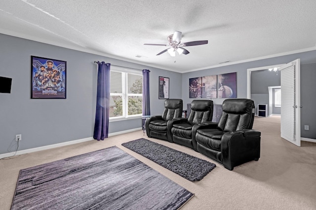 546 Township Cv, Collierville, TN 38017 - carpeted home theater featuring ceiling fan, a textured ceiling, healthy amount of natural light, baseboards, and crown molding