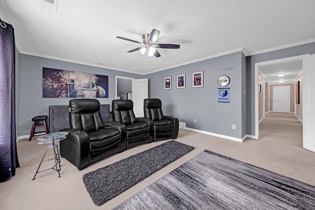 546 Township Cv, Collierville, TN 38017 - home theater room featuring carpet floors, ceiling fan, baseboards, ornamental molding, and a textured ceiling