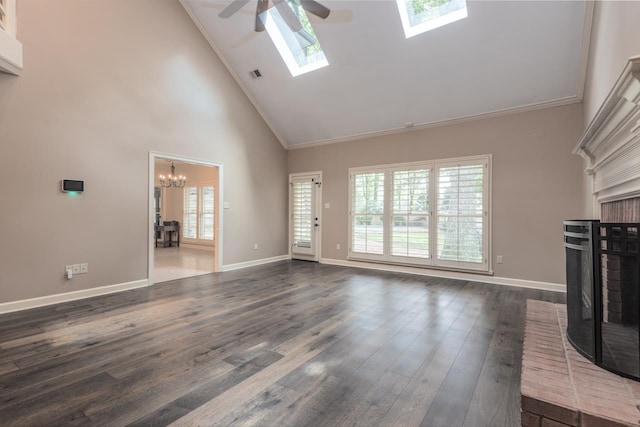 1625 Autumn Tree Cv, Memphis, TN 38016 - unfurnished living room featuring ceiling fan, high vaulted ceiling, a chandelier, dark wood-style floors, and baseboards
