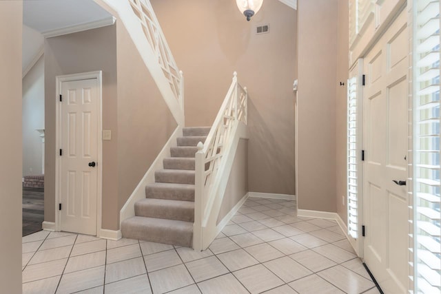 1625 Autumn Tree Cv, Memphis, TN 38016 - entrance foyer with tile patterned floors, stairway, and baseboards