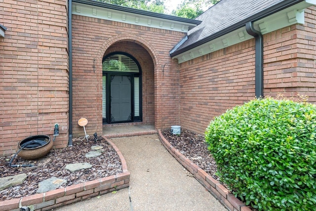 1625 Autumn Tree Cv, Memphis, TN 38016 - view of exterior entry with brick siding and roof with shingles