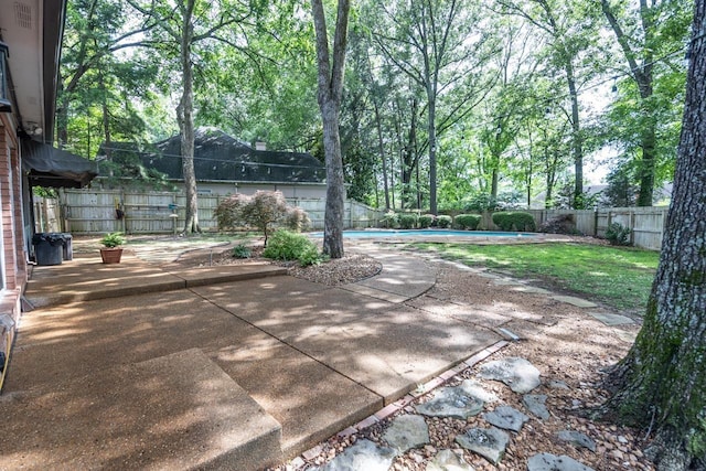 1625 Autumn Tree Cv, Memphis, TN 38016 - fenced backyard featuring a patio