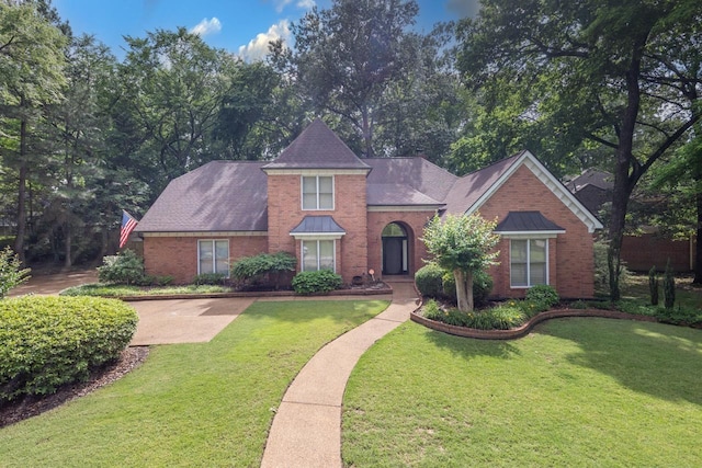 1625 Autumn Tree Cv, Memphis, TN 38016 - traditional-style home with brick siding and a front lawn